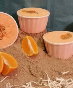 Spennende badeomber med duft av appelsin på sand